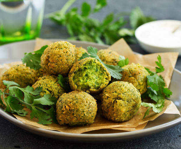 istock Fresh falafel balls on a dark background. 1141694147