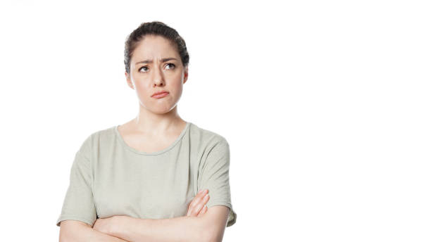istock unhappy concerned young woman thinking 1141694567
