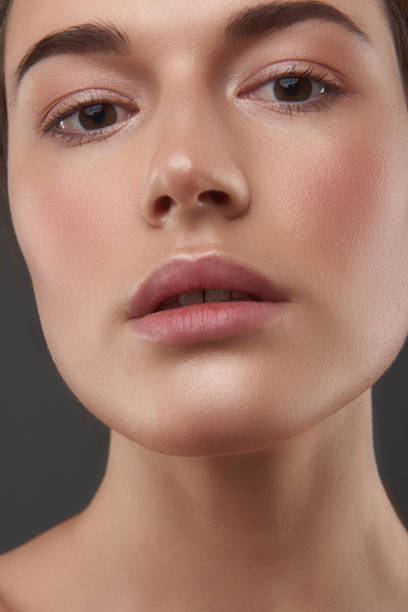 istock Charming young lady with perfect skin keeping mouth slightly open 1141694659