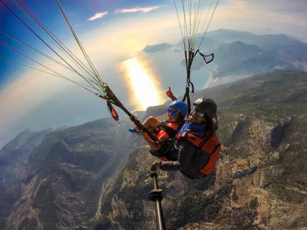 Photo of Tandem jump in paragliding.