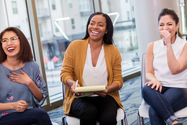 istock Three women laugh together 1141695635