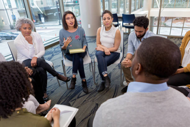 a difficult moment during a breakout session - mature adult women care listening imagens e fotografias de stock