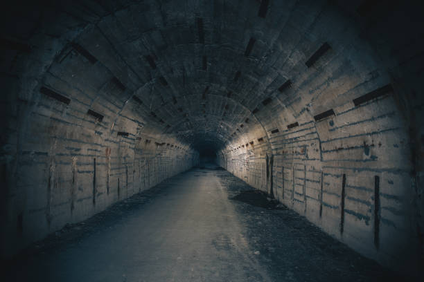 istock Dark creepy underground tunnel or corridor on abandoned Soviet military bunker 1141696699
