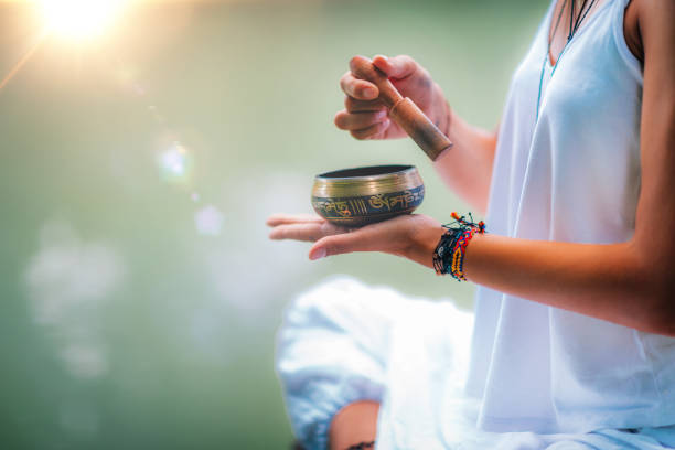 istock Young woman with Tibetan Singing Bowl 1141697061