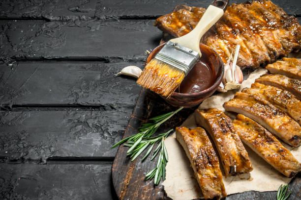 istock Sliced grilled ribs with sauce. 1141697838
