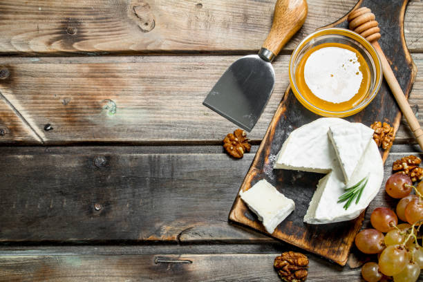 istock Brie cheese with honey and grapes. 1141699752
