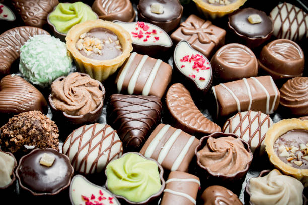 istock Chocolate candies with nuts and various fillings. 1141700193