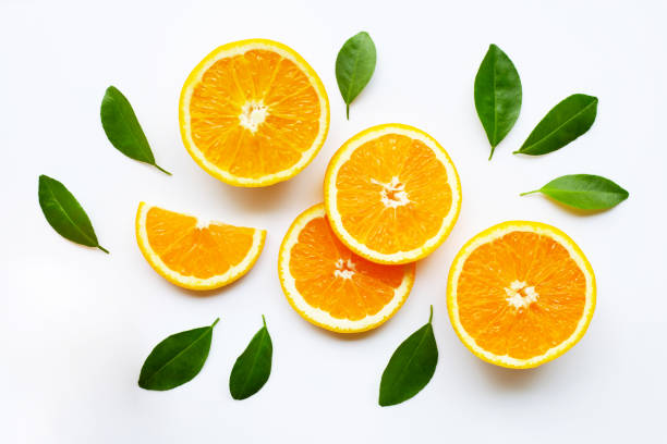 istock Fresh orange citrus fruit with leaves on white 1141701049