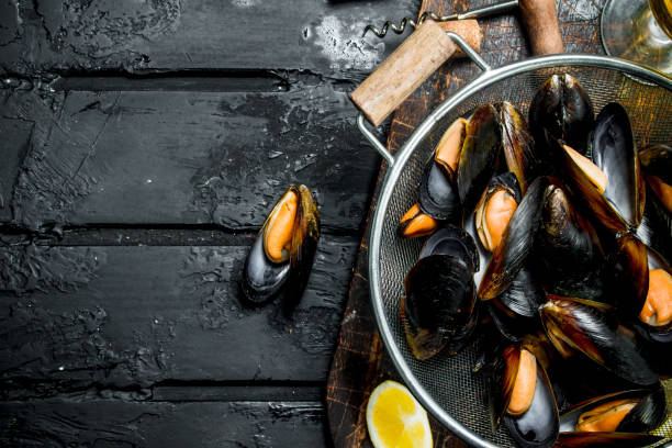 istock Fresh seafood clams in a saucepan. 1141701543