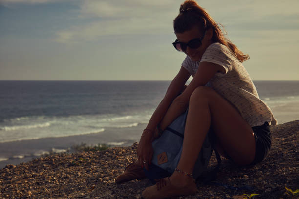 istock Tourist girl with backpack enjoying the view. 1141702264
