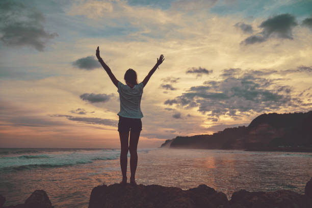 istock Attractive woman enjoying on the beach. 1141703538