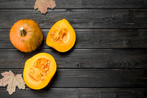 istock Pieces of pumpkin with leaves. 1141706904