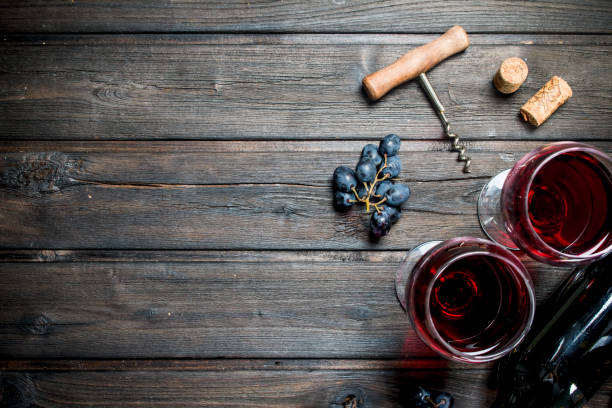 istock Wine background. Red wine with black grapes. 1141708538