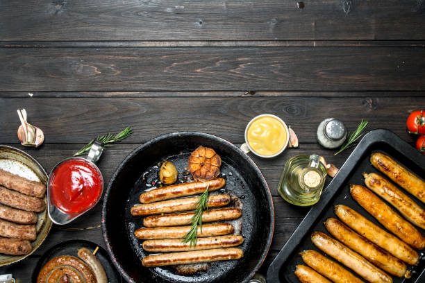 istock Assortment of different fried sausages with sauces. 1141710280