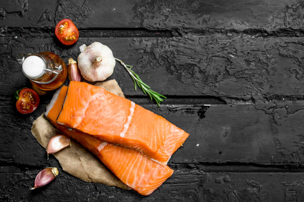 istock Raw salmon fish filet with spices. 1141711341