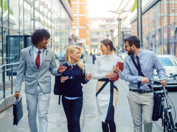 istock Group of business people walking talking 1141713598