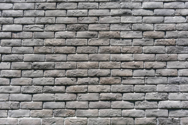 istock Grey concrete block wall background texture. Concrete block, stone texture, stone wall close-up. 1141714990