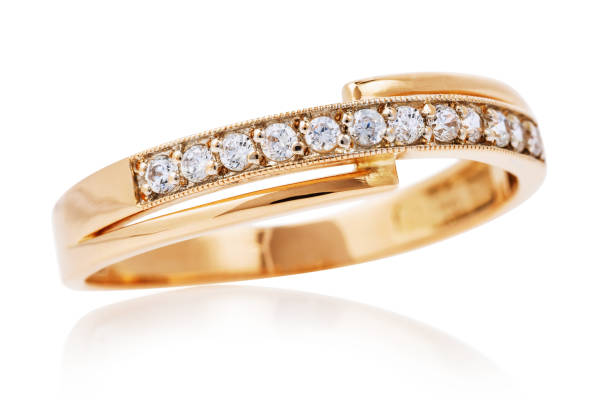 istock Beautiful golden ring with small diamonds isolated on white background 1141716134