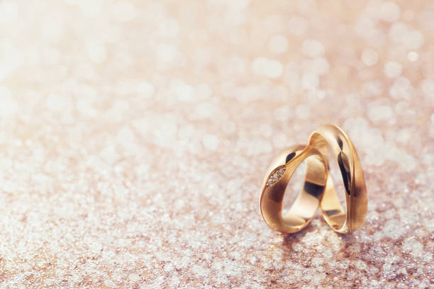 istock Two wedding rings on abstract background with copy space 1141716272