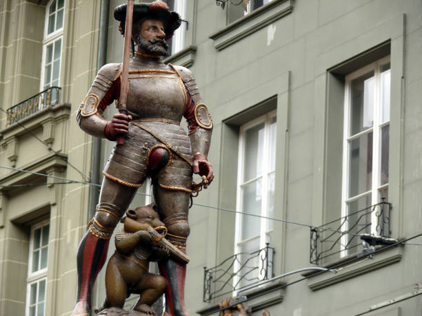 istock Bear monument with hunting rifle. 1141717945