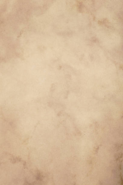 istock Old vintage brown paper parchment background 1141719212