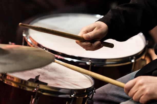istock The hands of a man playing a drum set 1141721075