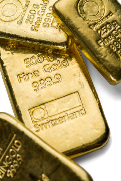 istock Several cast gold bars of different weight on a white 1141721364