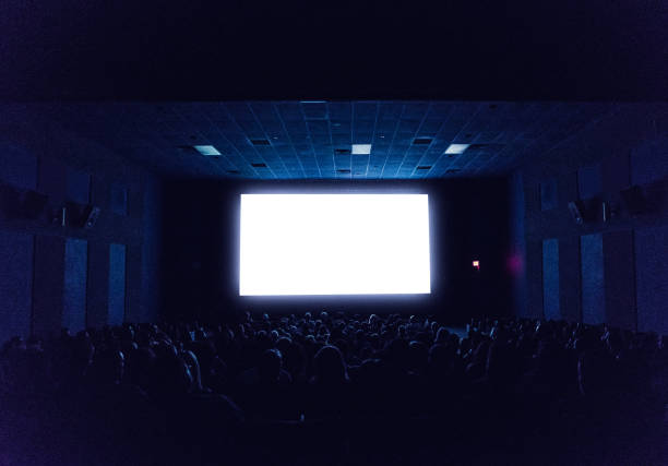 movie theatre Audience is ready for the movie. projection screen stock pictures, royalty-free photos & images