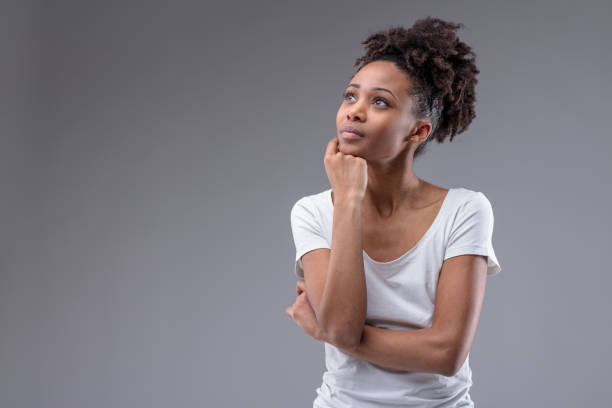 istock Pretty thoughtful young African woman 1141723099