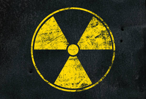 istock Yellow radioactive sign over black background 1141725852