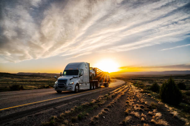 istock Long Haul Semi Truck on a Highway at Dusk under a Dramatic Sky 1141726181