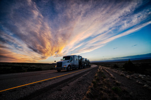 istock Long Haul Semi Truck on a Highway at Dusk under a Dramatic Sky 1141726360
