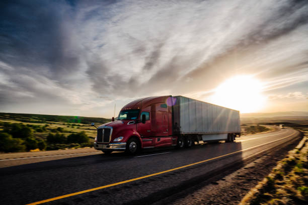 istock Long Haul Semi Truck on a Highway at Dusk under a Dramatic Sky 1141726627