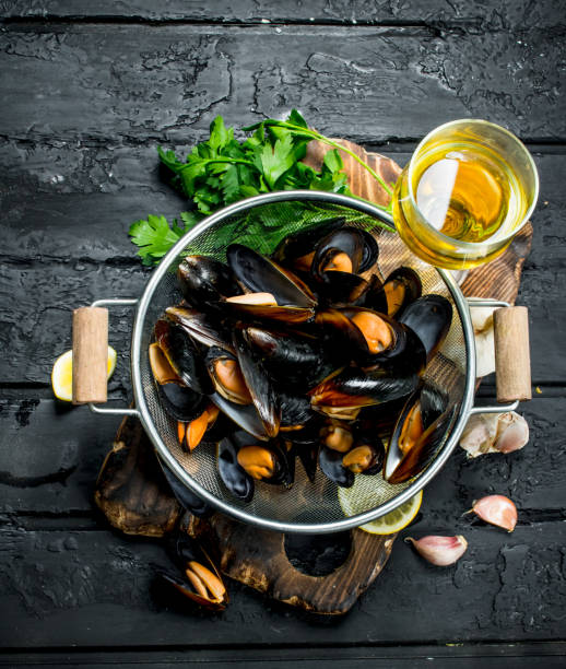 istock Fresh seafood clams with white wine and parsley. 1141727456