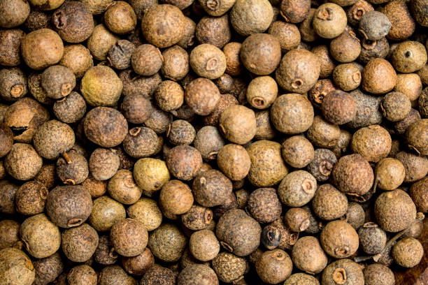 istock Peas of fragrant black pepper. 1141728020