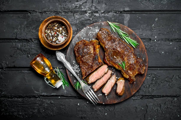istock Grilled beef steaks on a cutting Board. 1141728297