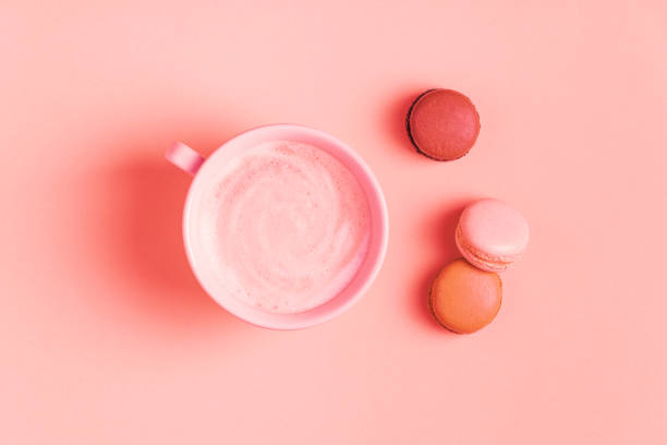 istock Cup of coffee with macaroons on pastel background 1141729116