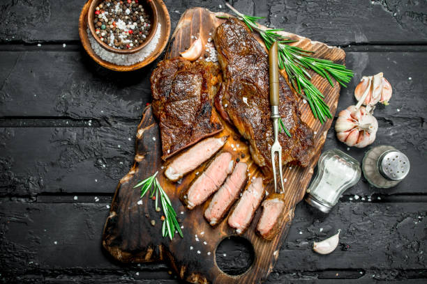 istock Grilled beef steak with rosemary and spices. 1141729207
