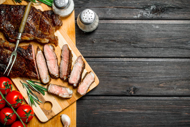 istock Grilled beef steak with herbs and spices. 1141729246