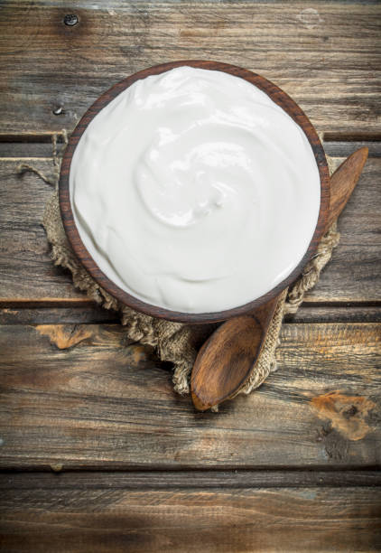 istock Fresh sour cream in bowl with spoon . 1141729447