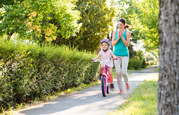 istock Mother And Daughter In Public Park 1141729485