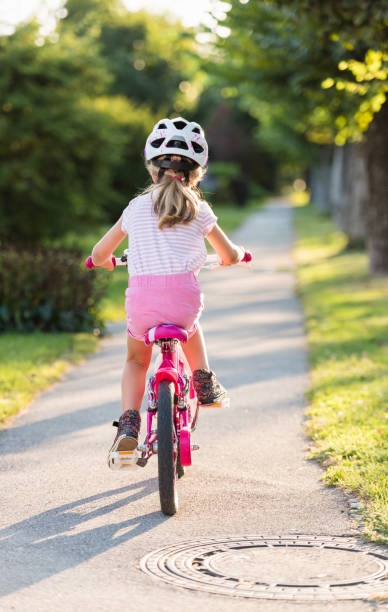 istock Girl Riding Bicycle 1141729489