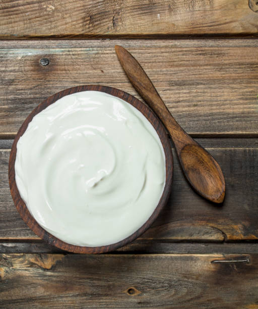 istock Fresh sour cream in bowl with spoon . 1141729574