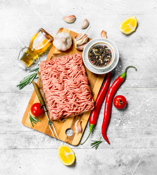 istock Raw minced beef with hot chili peppers and spices . 1141729712