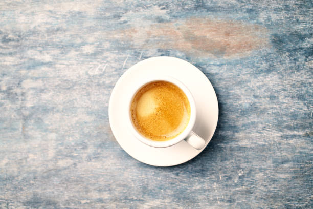 istock Cup of coffee on rustic wooden background. Copy space. Directly above. 1141729904