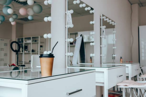 istock A cup of coffee on dressing table near mirror in makeup room 1141730167