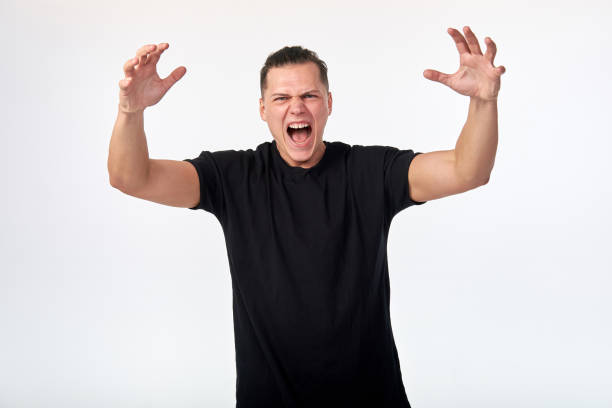 istock Young man screaming, quarreling. Negative feelings and human emotions. 1141731006