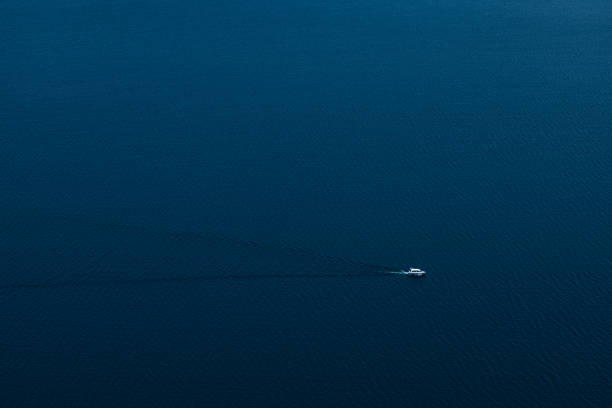 The ship is on the lake. Aerial view. The concept of tourism, recreation, travel. Minimalism.