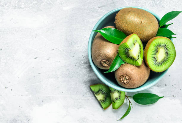 istock Kiwi with leaves in a bowl. 1141732973