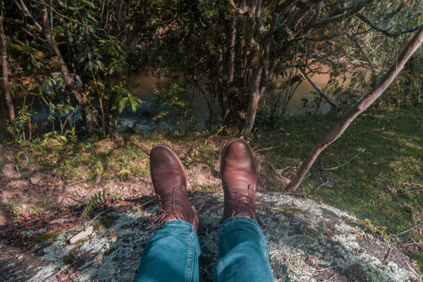 istock scene of man feet with blue pants 1141733113